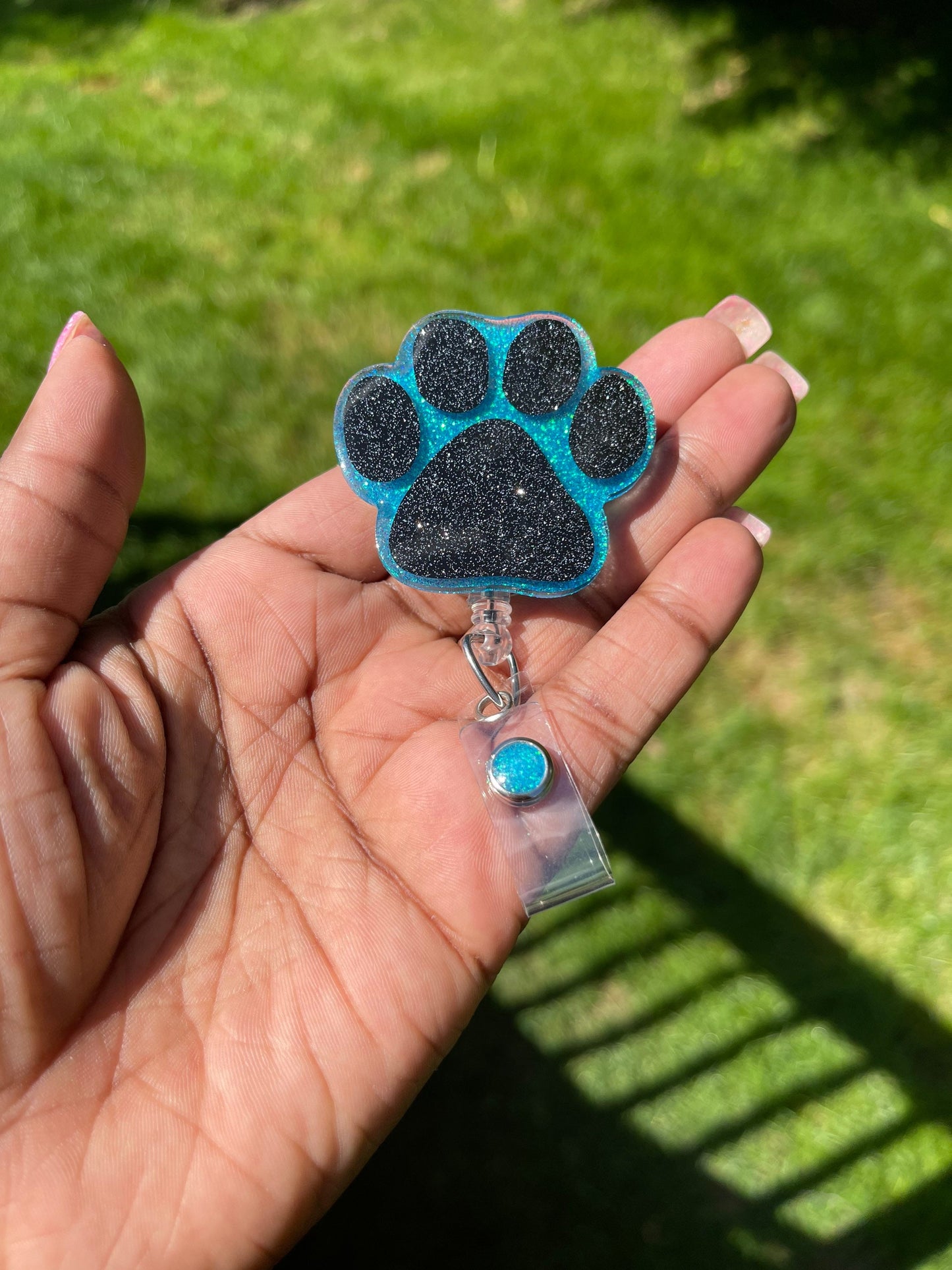 Paw print badge reel