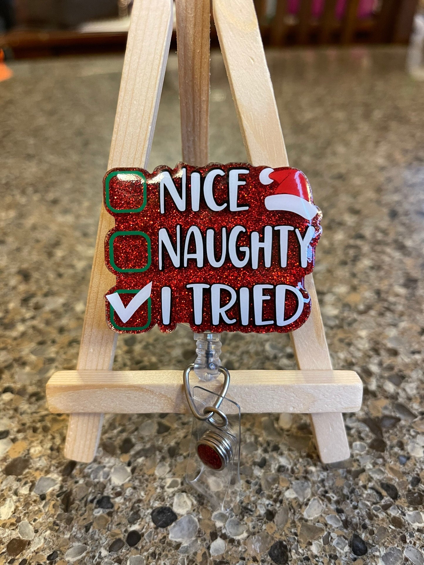 Naughty nice badge reel