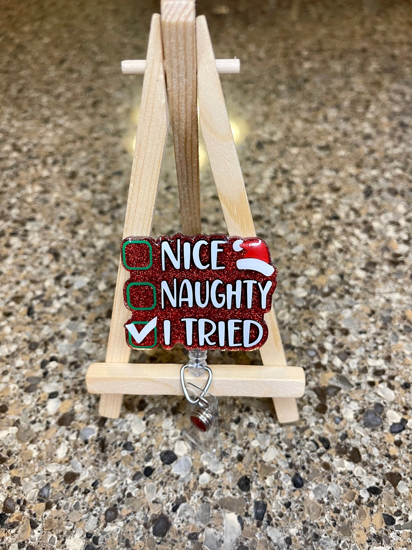 Naughty nice badge reel