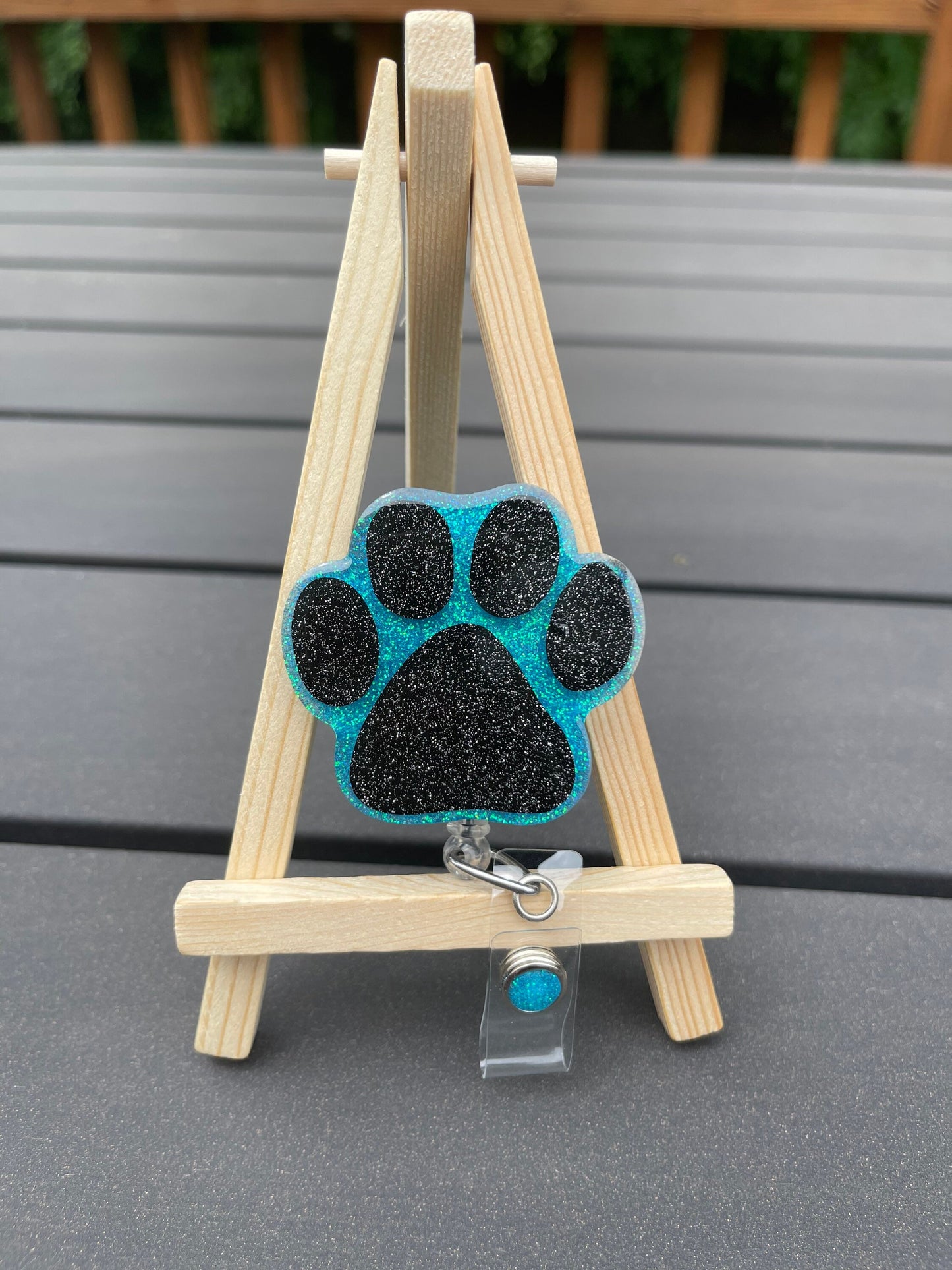 Paw print badge reel