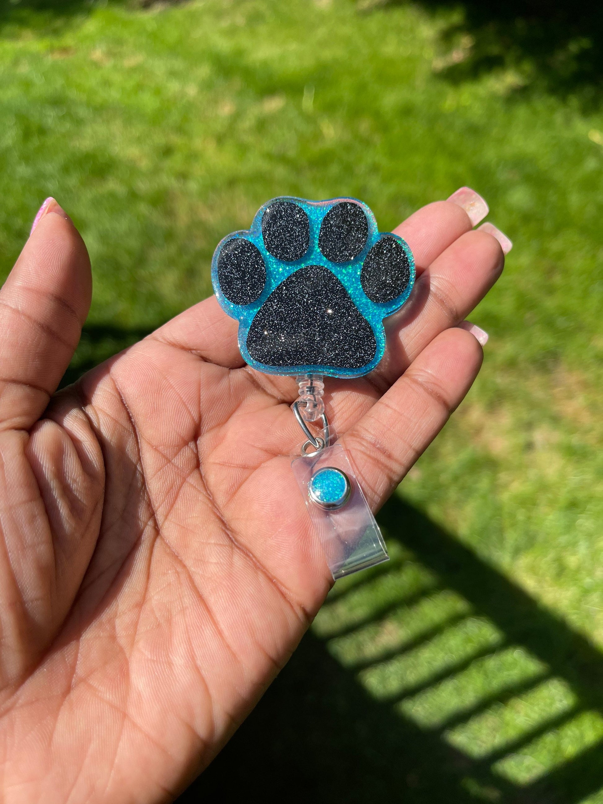 Paw print badge reel